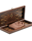 Diagonal view of 3-in-1 chess, checkers & backgammon set from Helena Wood Art showing interior backgammon board with marquetry, and drawstring bag holding wooden discs and dice.
