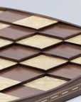 Close up view showing inlays and different 3D square levels of solid beech wood 3D Chess Board with walnut and mother of pearl inlays with pyramid-style design and 50mm squares.