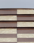 Super close up view showing different 3D square levels of solid beech wood 3D Chess Board with walnut and mother of pearl inlays with pyramid-style design and 50mm squares.