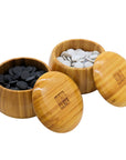 Go Bowls & Stones Set with lids lifted off 2 bamboo bowls showing black and white ceramic go stones