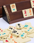 Close-up of luxury Rummikub set showing curved solid beech wood racks and heat-treated melamine tiles by Helena Wood Art