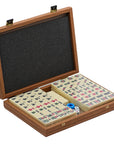 Premium mahjong tile set in walnut replica case displayed open with organised tiles