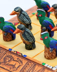 Close up of African Bird Noughts & Crosses resin game set with hand-painted birds showcasing Kingfisher & Loerie pieces