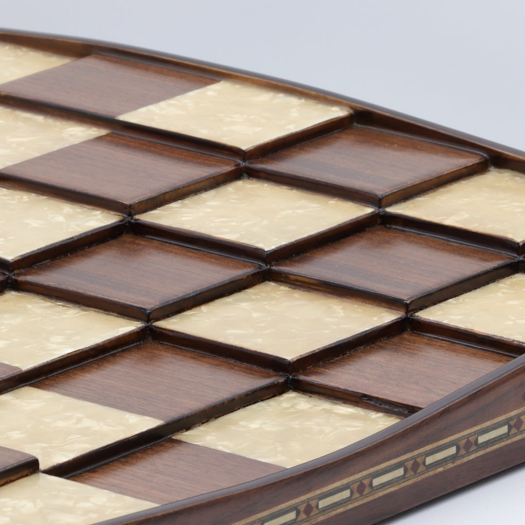 Close up view showing inlays and different 3D square levels of solid beech wood 3D Chess Board with walnut and mother of pearl inlays with pyramid-style design and 50mm squares.
