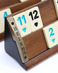 Solid beech wood Rummikub set front showing melamine tiles and metallic plate with logo 