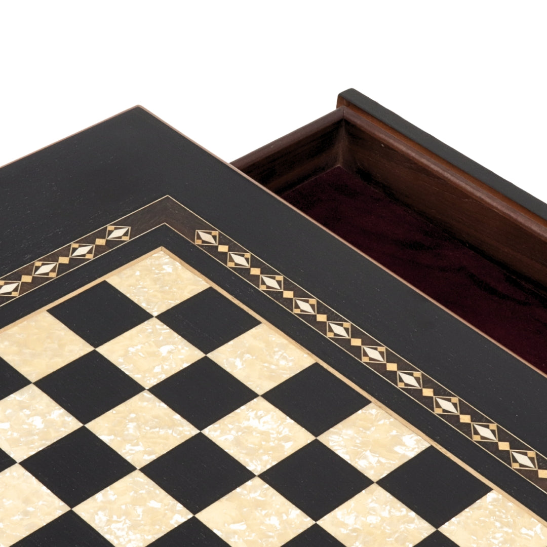 Close-up top view of Black Chess Table with Drawers featuring Mother of Pearl inlaid design and robust walnut legs, showing one drawer open and chess board playing surface
