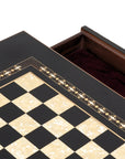 Close-up top view of Black Chess Table with Drawers featuring Mother of Pearl inlaid design and robust walnut legs, showing one drawer open and chess board playing surface