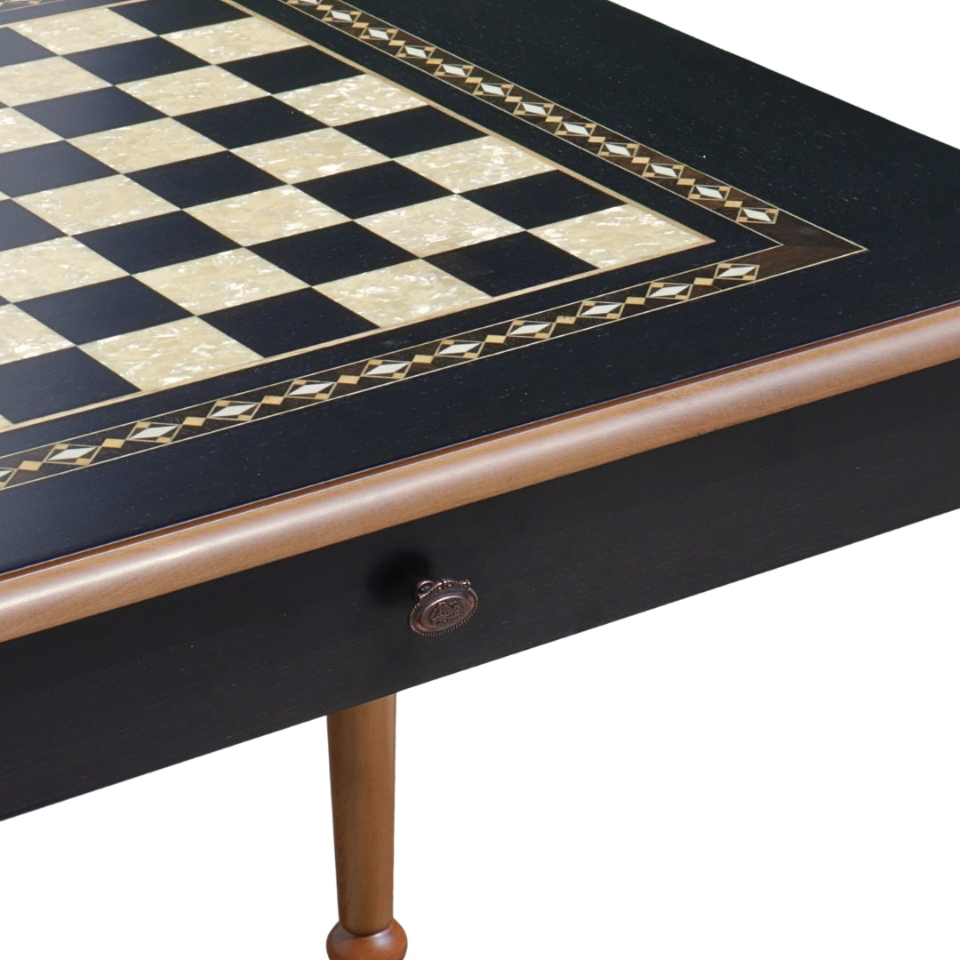 Close-up side top overview of Black Chess Table with Drawers featuring Mother of Pearl inlaid design and robust walnut legs, showing closed drawer with handle and chess board playing surface
