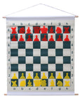 Demonstration chess set roll-up board with red & yellow stick-in pieces hanging on wall