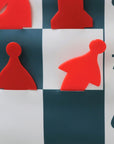 Demonstration chess set stick-in pieces inserted into pocket