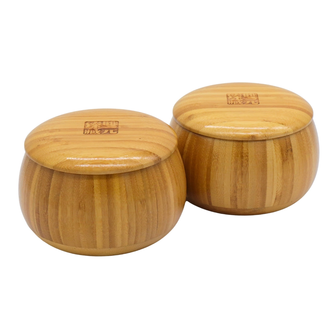 Go Bowls &amp; Stones Set showing closed bamboo bowls containing black and white go stones