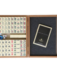 Top view of flat layed premium mahjong tile set in walnut replica case displayed open with organised tiles