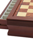 Side view close-up of maple mahogany chess board with drawers 45mm squares with one drawer open showing compartments for piece storage