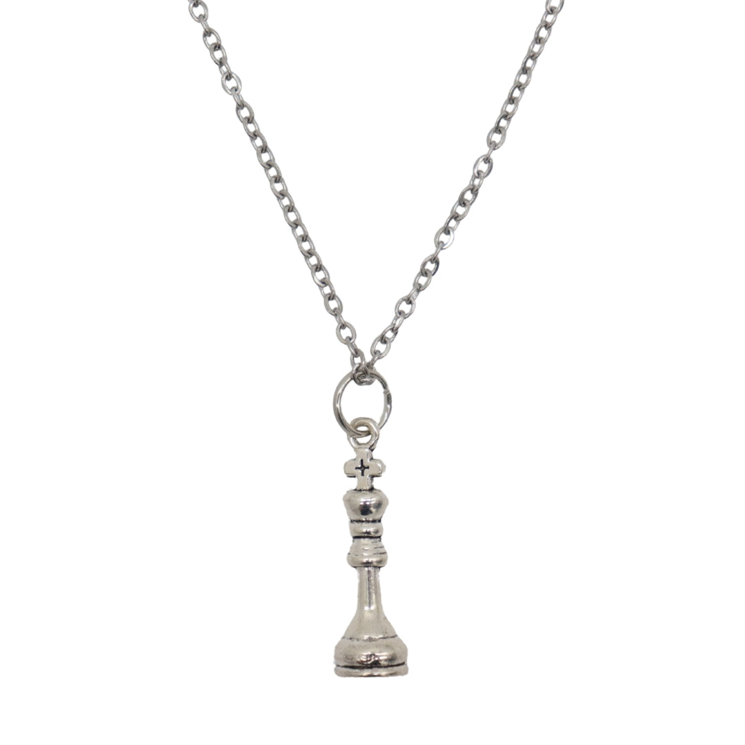 Silver pendant necklace with a King chess piece charm.