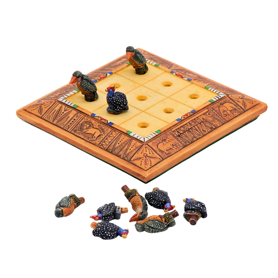 African Bird Noughts &amp; Crosses resin game set with hand-painted birds showcasing board with slots for pieces side view