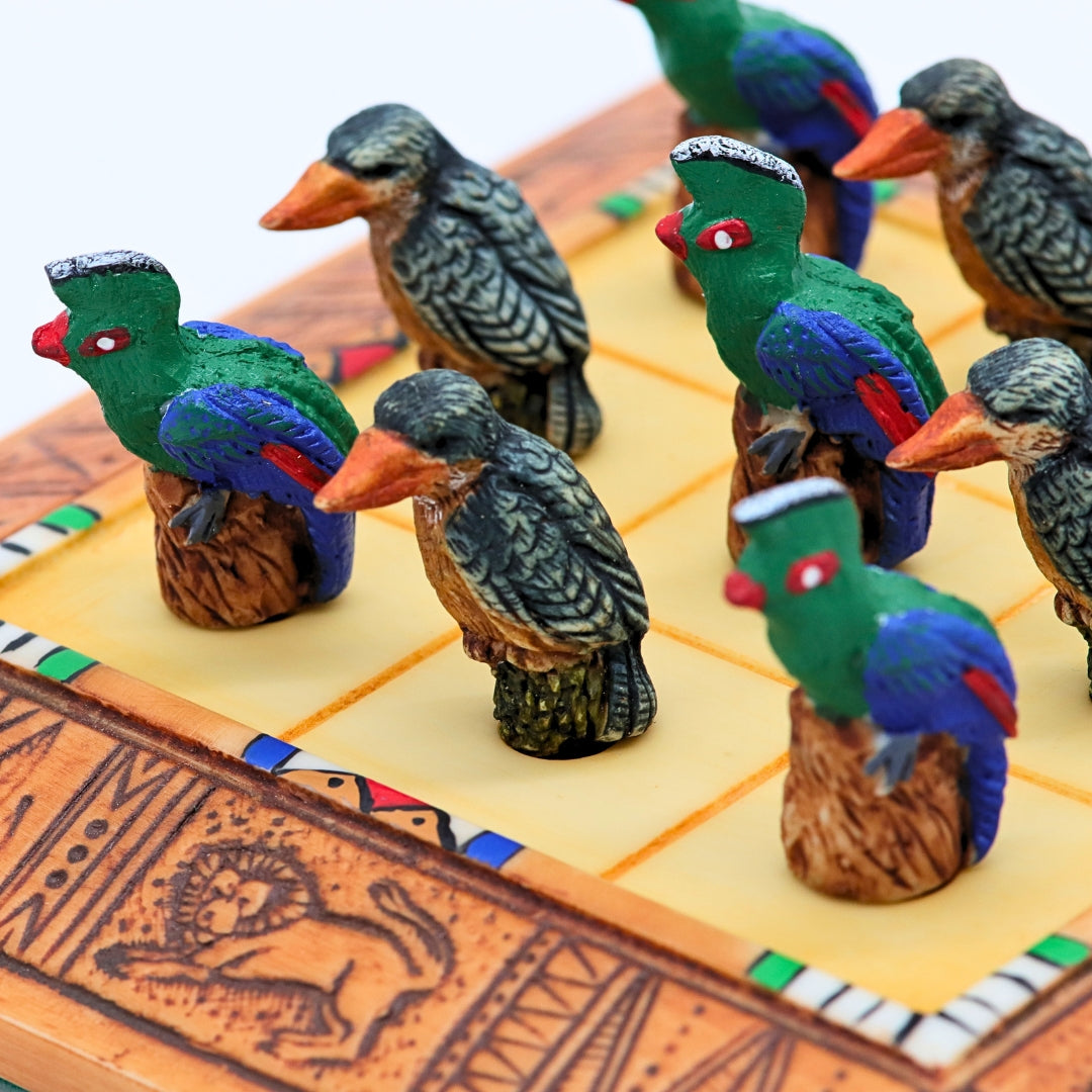 Close up of African Bird Noughts &amp; Crosses resin game set with hand-painted birds showcasing Kingfisher &amp; Loerie pieces
