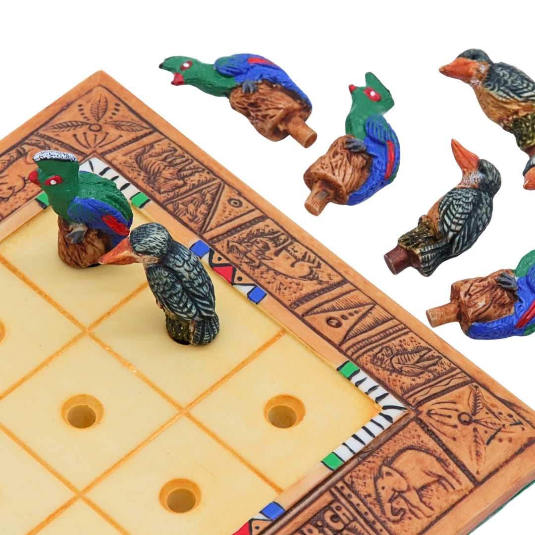 African Bird Noughts &amp; Crosses resin game set with hand-painted birds showcasing board with slots for pieces