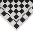 Close-up of a Roll-Up Chess Board with black and pure white squares and algebraic notation comparing two sizes.