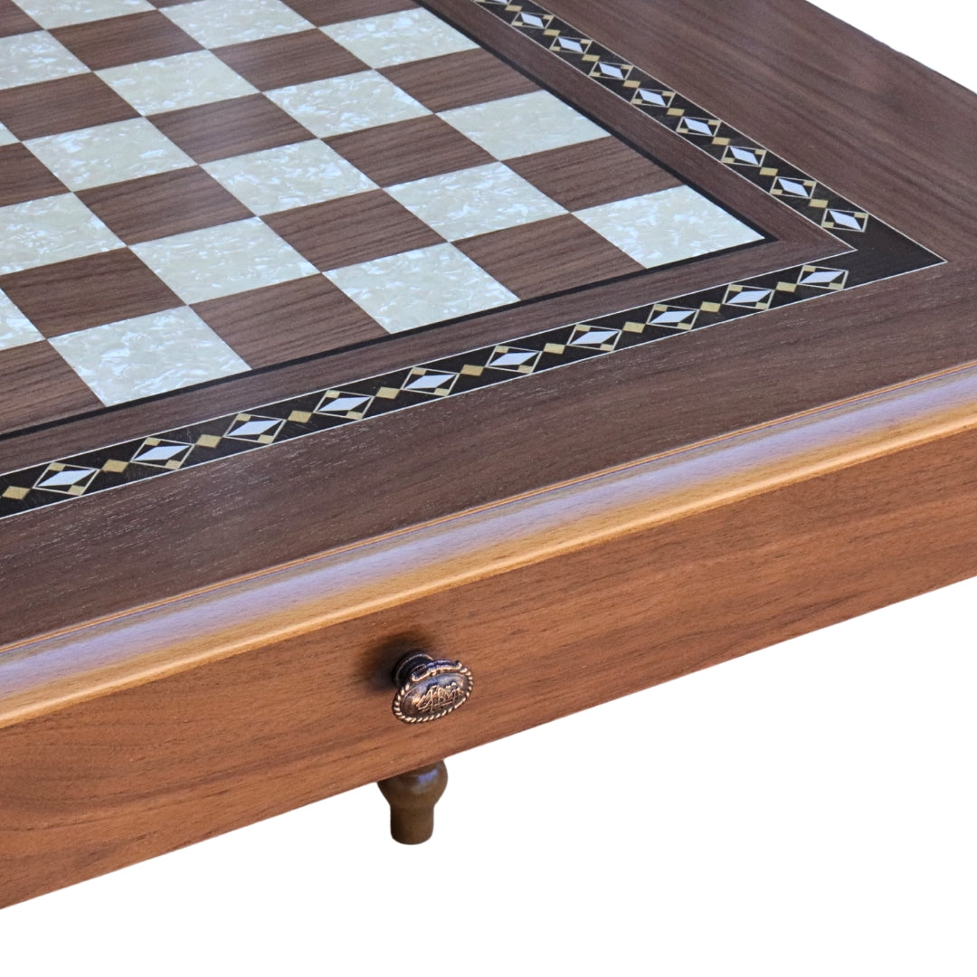 Close-up side top overview of Walnut Chess Table with Drawers featuring Mother of Pearl inlaid design and robust walnut legs, showing closed drawer with handle and chess board playing surface
