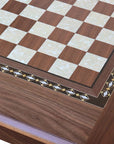 Close-up top view of Walnut Chess Table with Drawers featuring Mother of Pearl inlaid design and robust walnut legs, showing intricate detail of chess board playing surface