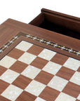 Close-up top view of Walnut Chess Table with Drawers featuring Mother of Pearl inlaid design and robust walnut legs, showing one drawer open and chess board playing surface